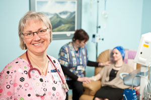 nurses in hospital room with patient