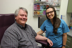 nurse with patient in treatment room