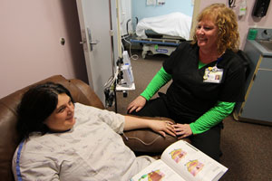 nurse with patient in treatment room